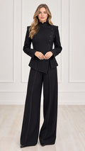 Full front view of women's black asymmetric high-neck blazer and wide-leg trousers suit set