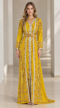 Front view of model wearing Yellow embroidered Moroccan caftan maxi gown with belt