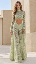 Model wearing sage green embellished lace crop top and matching wide leg pants front view
