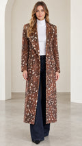 Front full-length view of woman wearing brown speckled tailored maxi coat