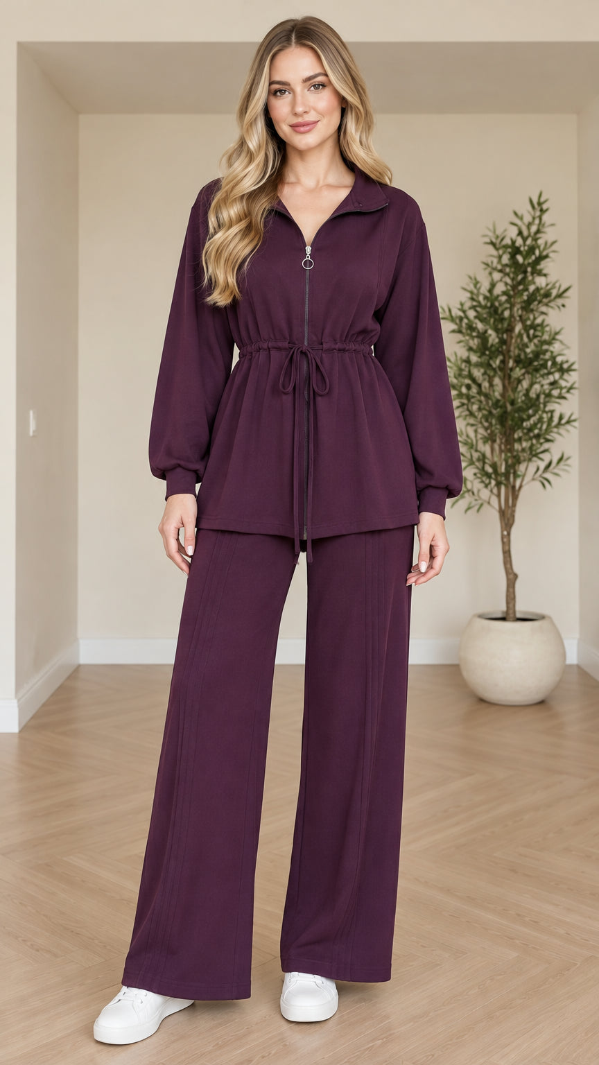 Full front view of model wearing plum quarter-zip drawstring top and matching wide-leg pants set