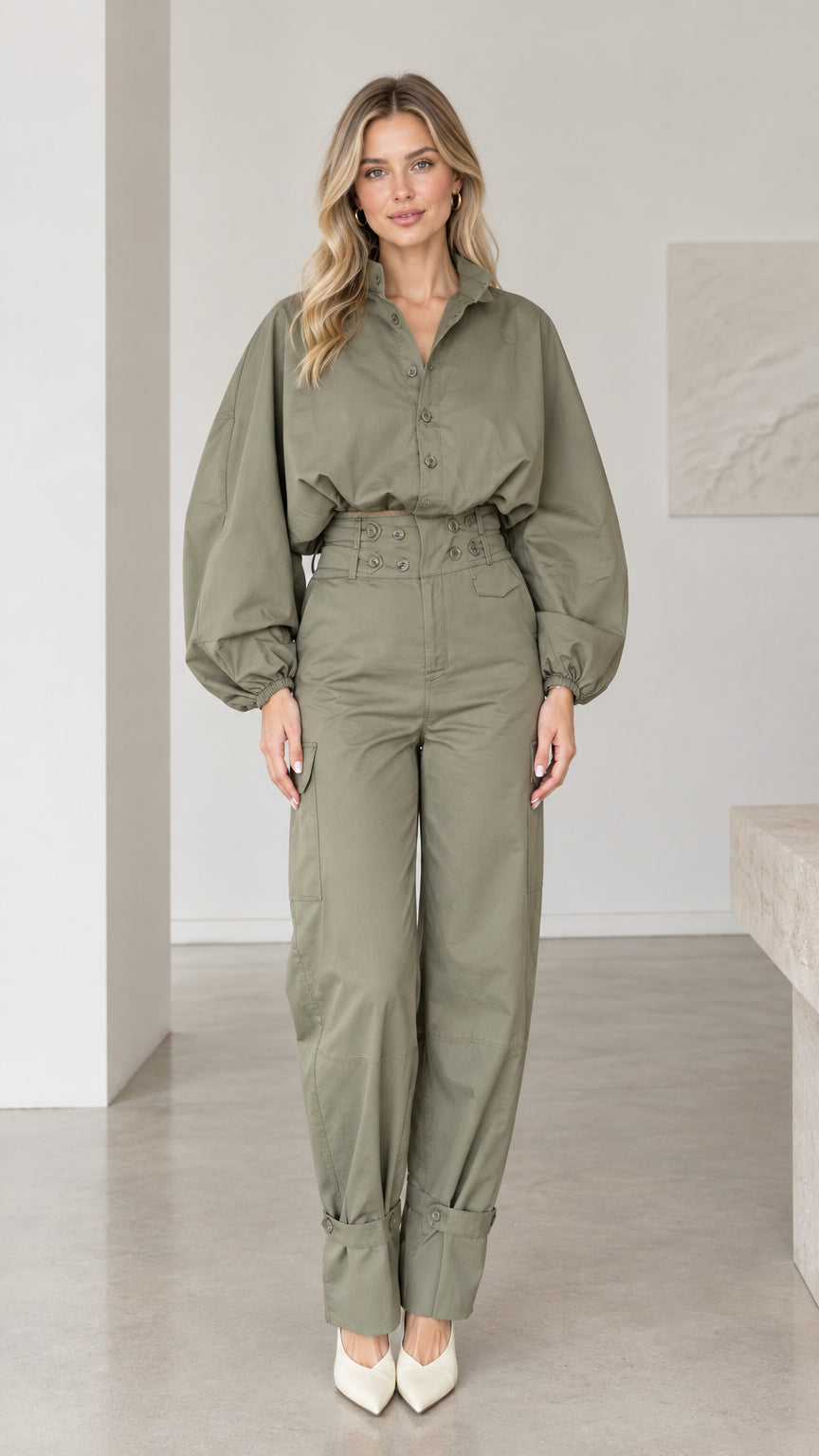 Front full-length view of woman wearing olive green lantern sleeve cargo jumpsuit