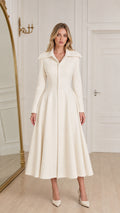 Model wearing ivory white vintage fit and flare midi coat dress front view