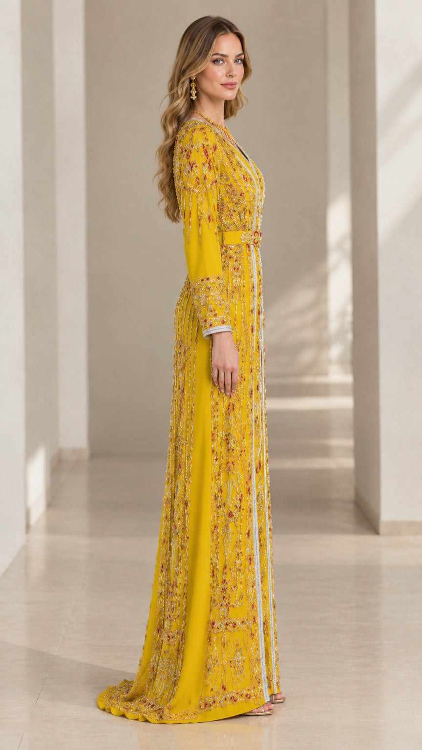 Side profile of model in Yellow long sleeve beaded caftan evening dress
