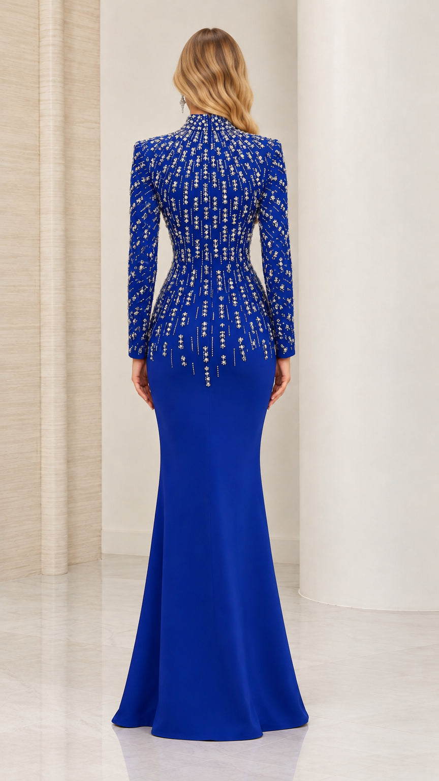 Back view of royal blue long sleeve beaded evening dress with mermaid skirt