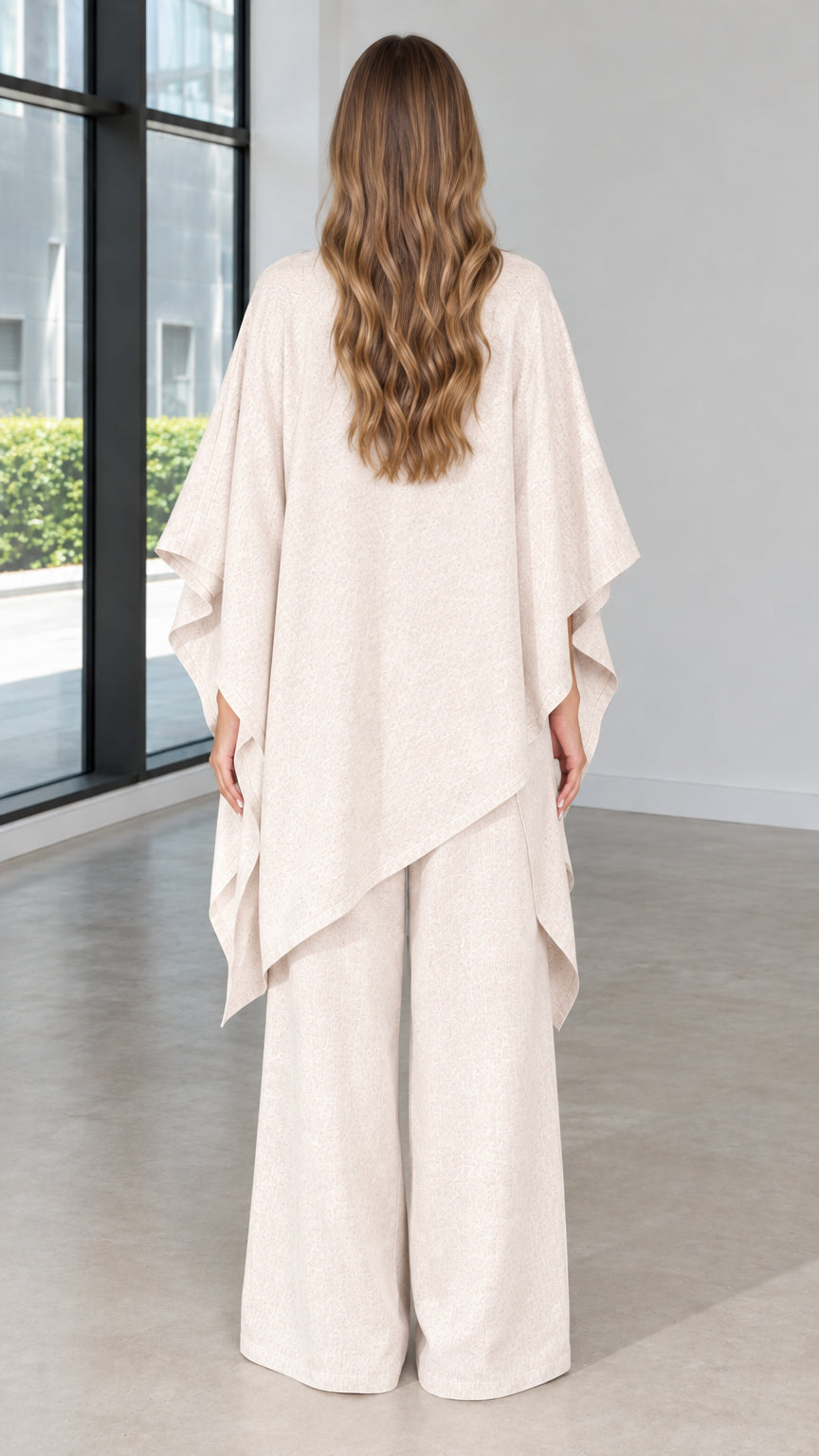 Back view of beige draped kimono cape and wide leg pant two piece set