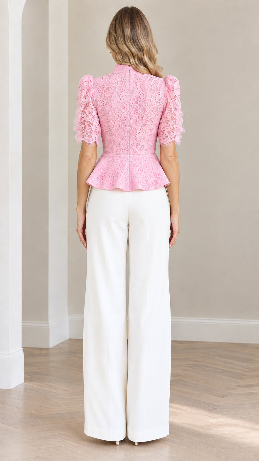 Back view of model wearing blush pink lace short sleeve peplum top
