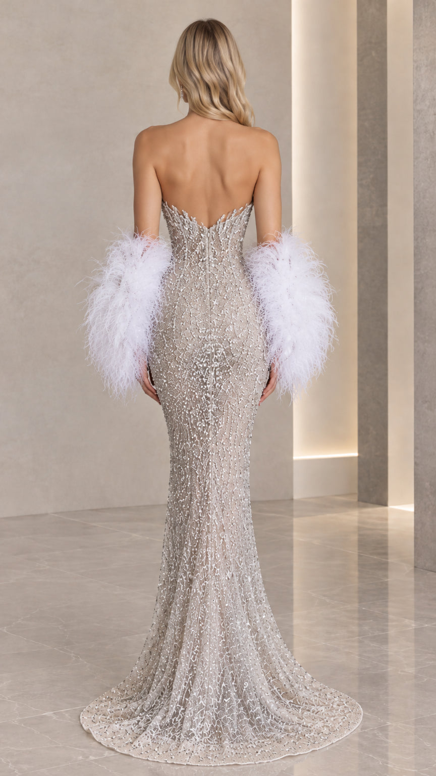 Back full view of silver strapless beaded evening dress with train