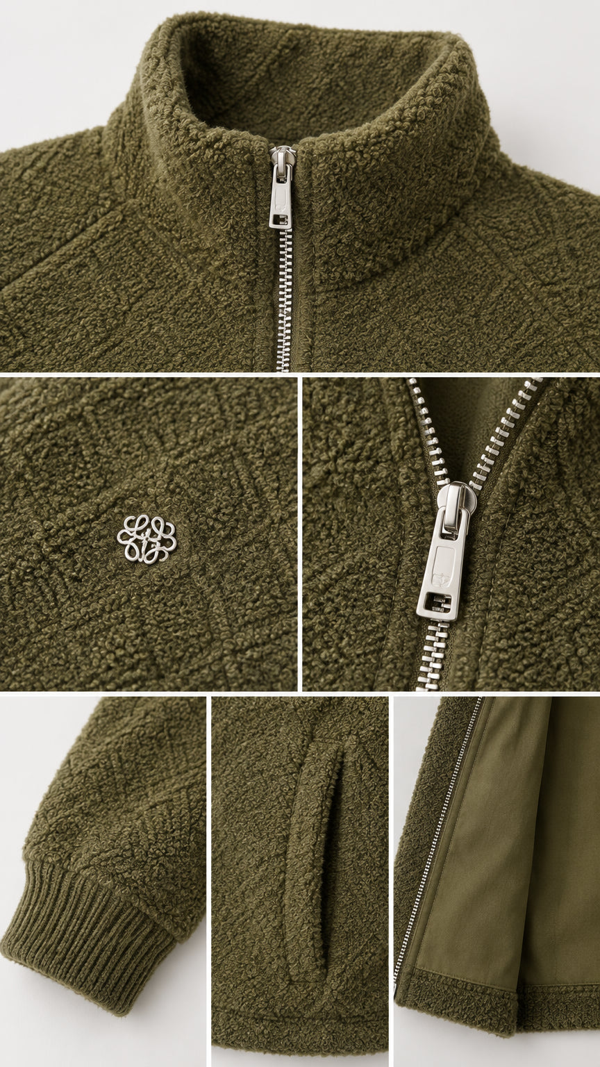 Close-up details of collar, metal zip, textured fleece fabric, side pocket, and ribbed cuff