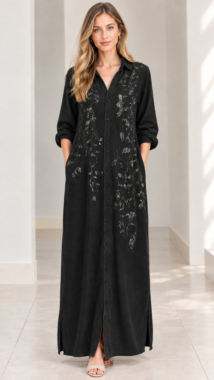 Front view of woman wearing black embroidered maxi shirt dress