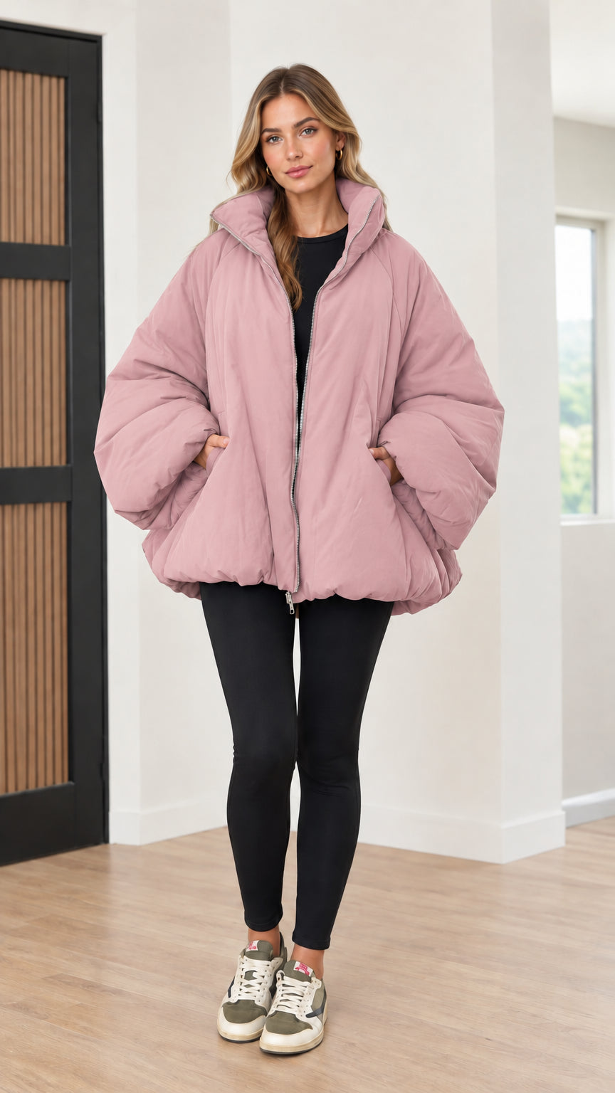 Model wearing dusty pink cocoon bubble puffer coat