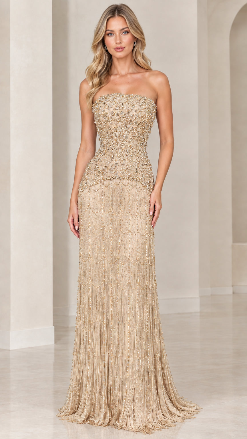 Model wearing champagne gold strapless beaded evening gown